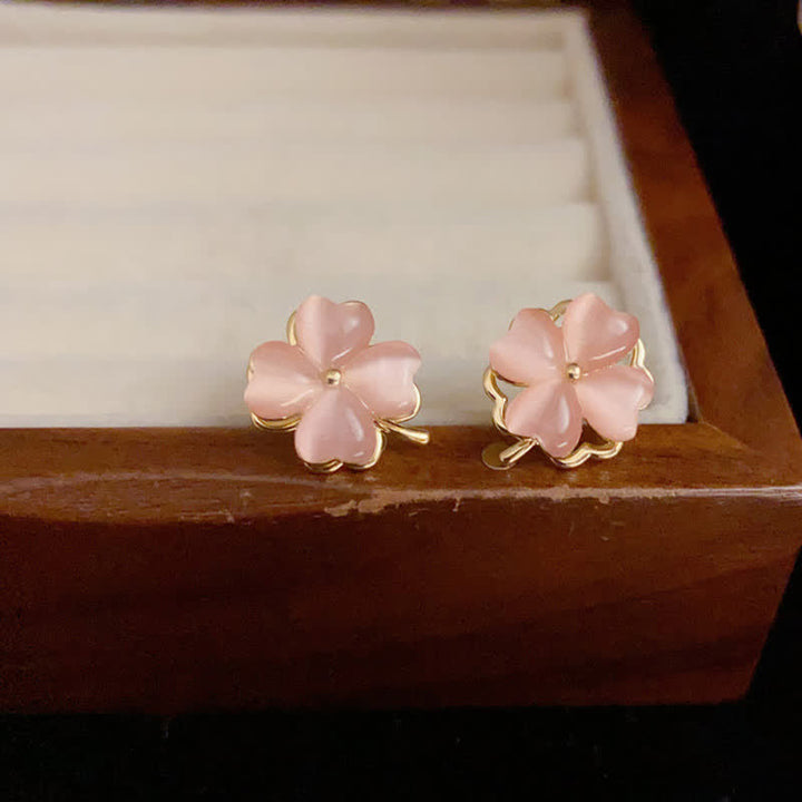Buddha Stones Boucles d'oreilles à clous œil-de-chat rose à quatre feuilles, design rotatif - image 1