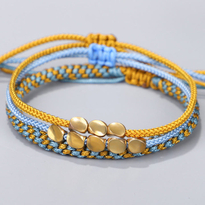 Buddha Stones Bracelet de guérison composé de 3 perles bleues, jaunes et dorées en cuivre, avec cordon et cordon. - Cordon (Tour de poignet : 16-26 cm) - image 0