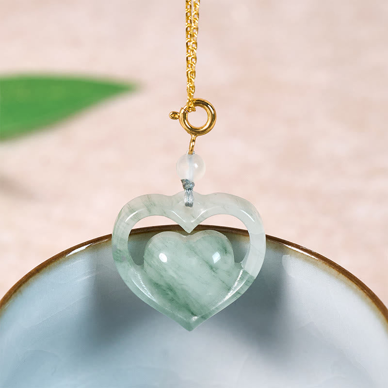 Buddha Stones Pendentif collier en jade en forme de cœur creux, symbole d'abondance et d'amour - Jade doré naturel (la couleur et la taille peuvent varier) - image 0