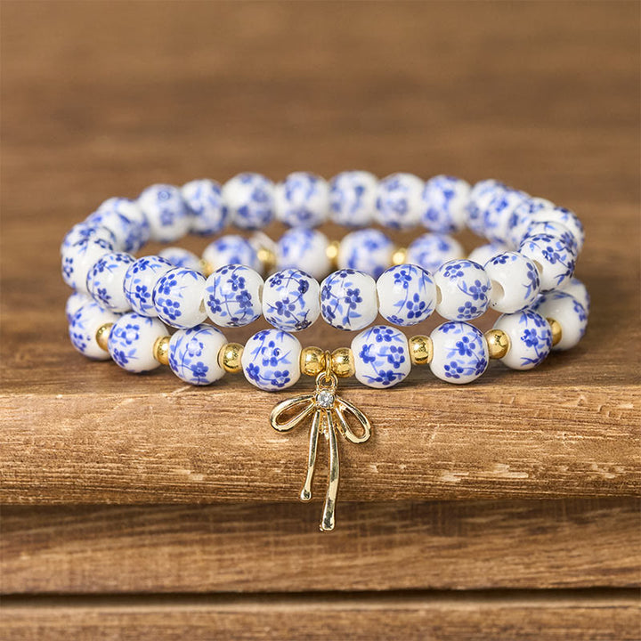 Buddha Stones Bracelet intérieur de la paix en porcelaine rose et blanche, orné d'un nœud papillon et de perles bleues et blanches - Bleu et blanc (Tour de poignet : 15-16 cm) - image 0