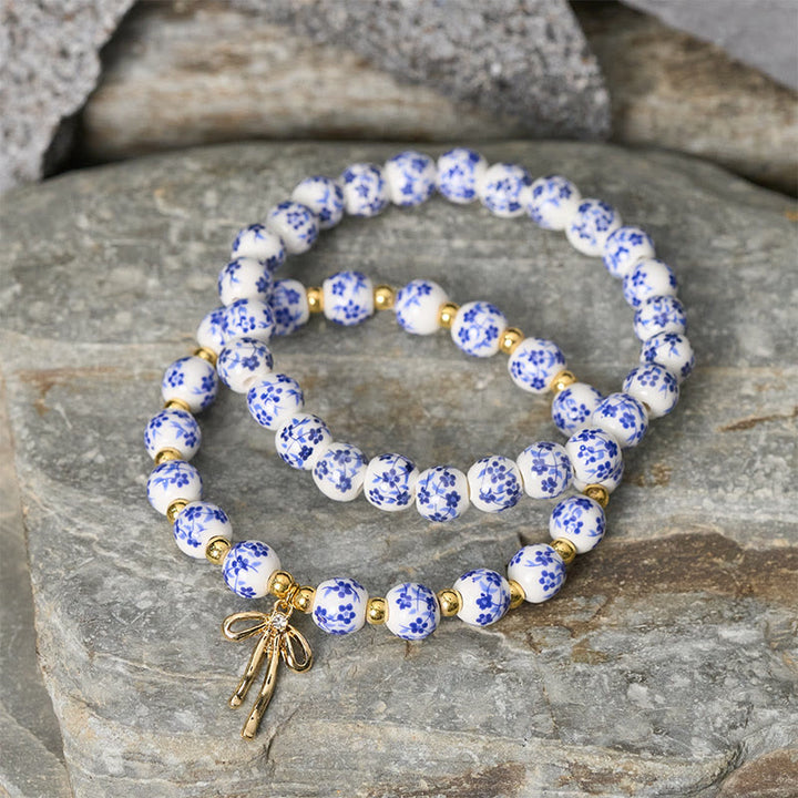 Buddha Stones Bracelet intérieur de la paix en porcelaine rose et blanche, orné d'un nœud papillon et de perles bleues et blanches - image 2