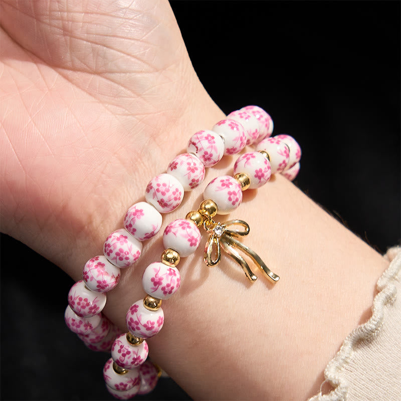 Buddha Stones Bracelet intérieur de la paix en porcelaine rose et blanche, orné d'un nœud papillon et de perles bleues et blanches - image 9