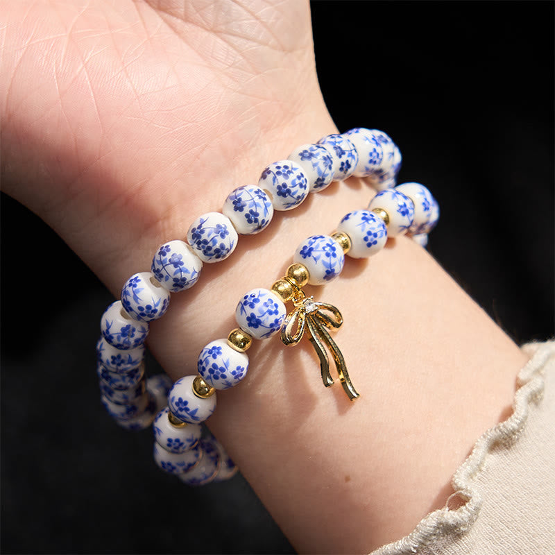 Buddha Stones Bracelet intérieur de la paix en porcelaine rose et blanche, orné d'un nœud papillon et de perles bleues et blanches - image 3