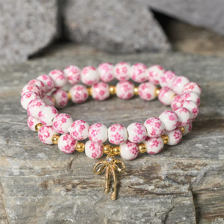 Buddha Stones Bracelet intérieur de la paix en porcelaine rose et blanche, orné d'un nœud papillon et de perles bleues et blanches - image 7