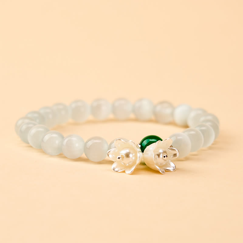 Buddha Stones Bracelet positif en perles rondes œil-de-chat blanches de 8 mm, motif muguet - image 1