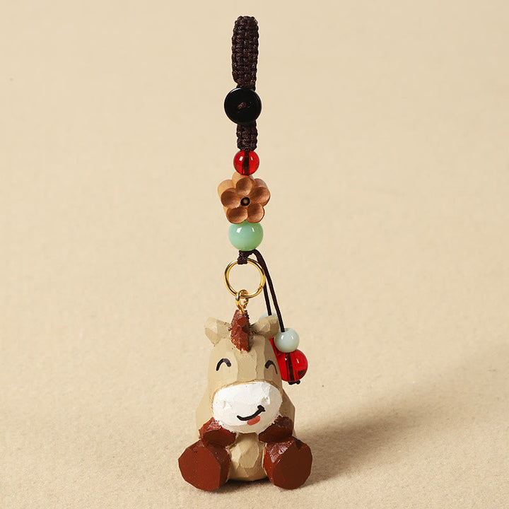 Buddha Stones Porte-clés en bois de tilleul gravé de fleurs de prunier, symbole de paix et de bien-être : Om Mani Padme Hum. - Cheval 4 cm (la couleur, la forme et la taille peuvent varier) - Fleur de prunier - image 1