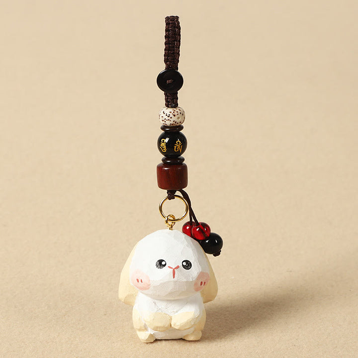 Buddha Stones Porte-clés en bois de tilleul gravé de fleurs de prunier, symbole de paix et de bien-être : Om Mani Padme Hum. - Lapin 4 cm (la couleur, la forme et la taille peuvent varier) - Om Mani Padme Hum - image 16