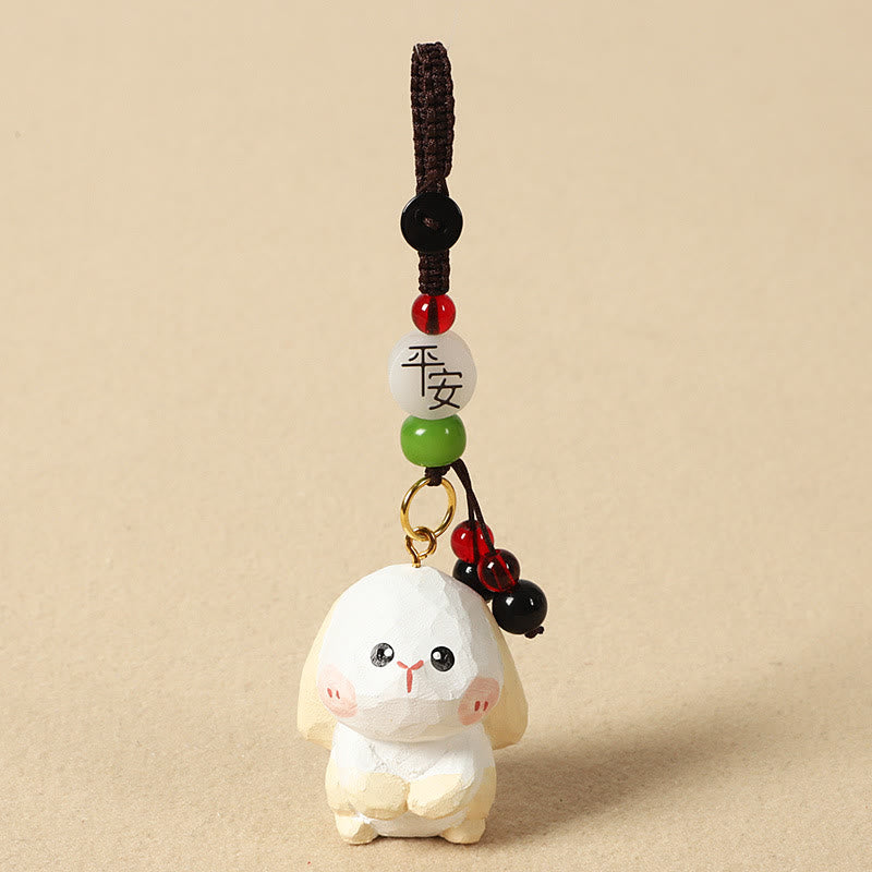 Buddha Stones Porte-clés en bois de tilleul gravé de fleurs de prunier, symbole de paix et de bien-être : Om Mani Padme Hum. - Lapin 4 cm (la couleur, la forme et la taille peuvent varier) - Paix et sécurité - image 18
