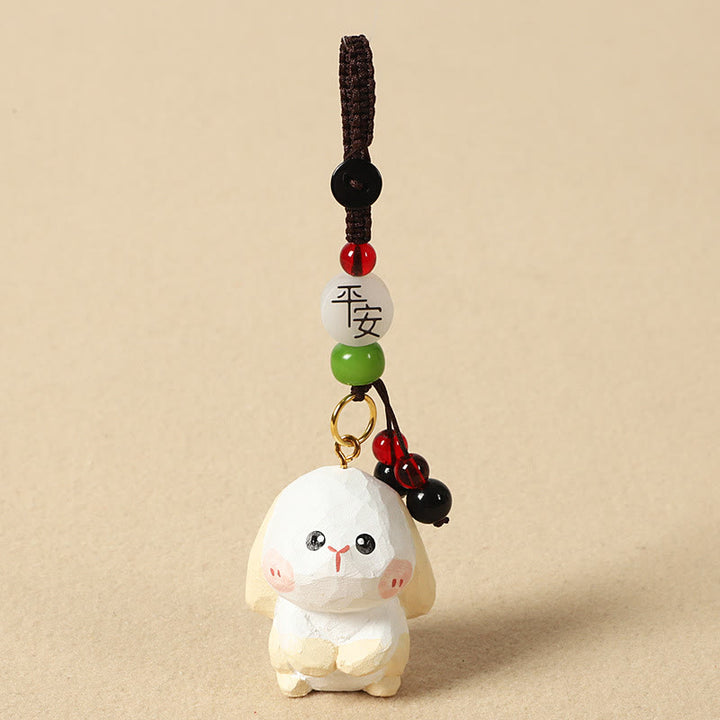 Buddha Stones Porte-clés en bois de tilleul gravé de fleurs de prunier, symbole de paix et de bien-être : Om Mani Padme Hum. - Lapin 4 cm (la couleur, la forme et la taille peuvent varier) - Paix et sécurité - image 18