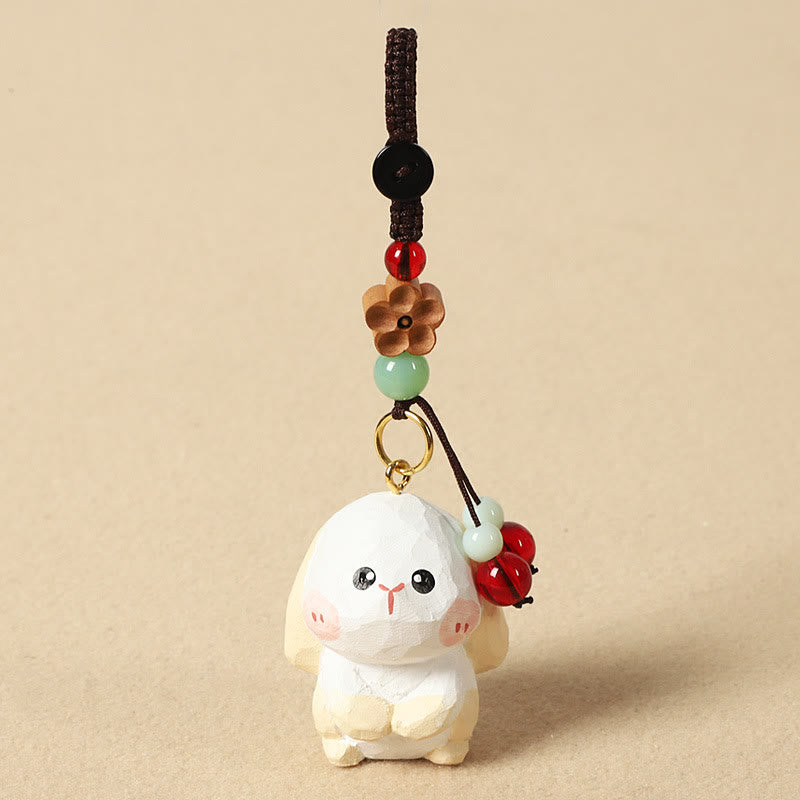 Buddha Stones Porte-clés en bois de tilleul gravé de fleurs de prunier, symbole de paix et de bien-être : Om Mani Padme Hum. - Lapin 4 cm (la couleur, la forme et la taille peuvent varier) - Fleur de prunier - image 17