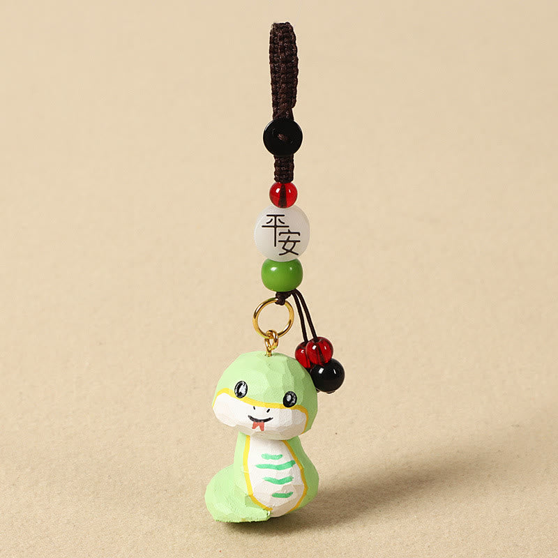 Buddha Stones Porte-clés en bois de tilleul gravé de fleurs de prunier, symbole de paix et de bien-être : Om Mani Padme Hum. - Serpent 4 cm (la couleur, la forme et la taille peuvent varier) - Paix et sécurité - image 25