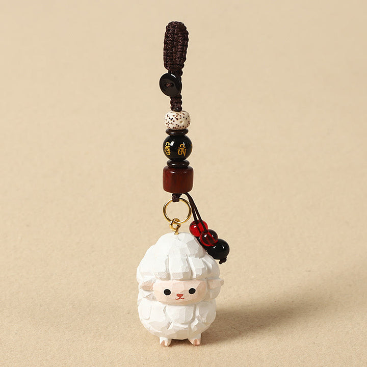 Buddha Stones Porte-clés en bois de tilleul gravé de fleurs de prunier, symbole de paix et de bien-être : Om Mani Padme Hum. - Chèvre 4 cm (la couleur, la forme et la taille peuvent varier) - Om Mani Padme Hum - image 26