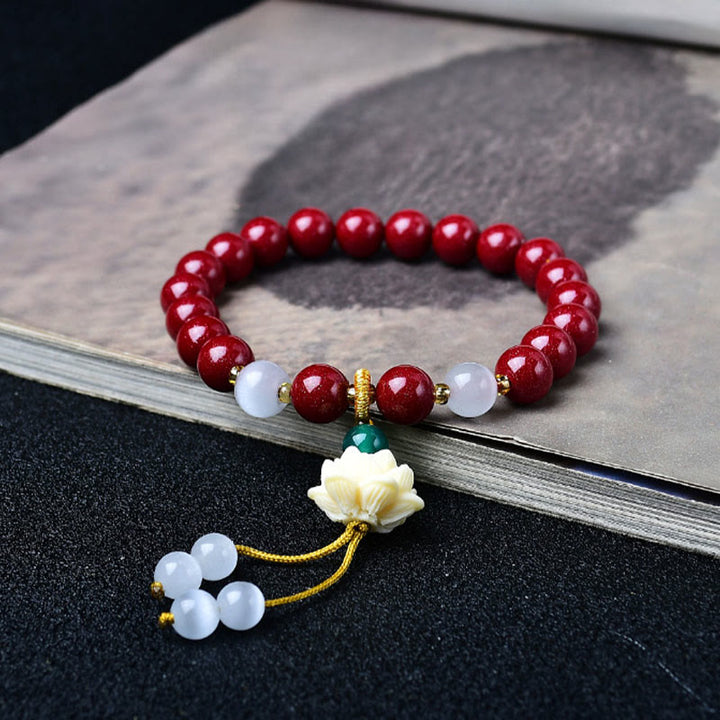 Buddha Stones Bracelet de bénédiction avec breloque lotus en ivoire œil de chat et cinabre naturel - 8 mm Cinabre (Tour de poignet : 15–16 cm) - image 0