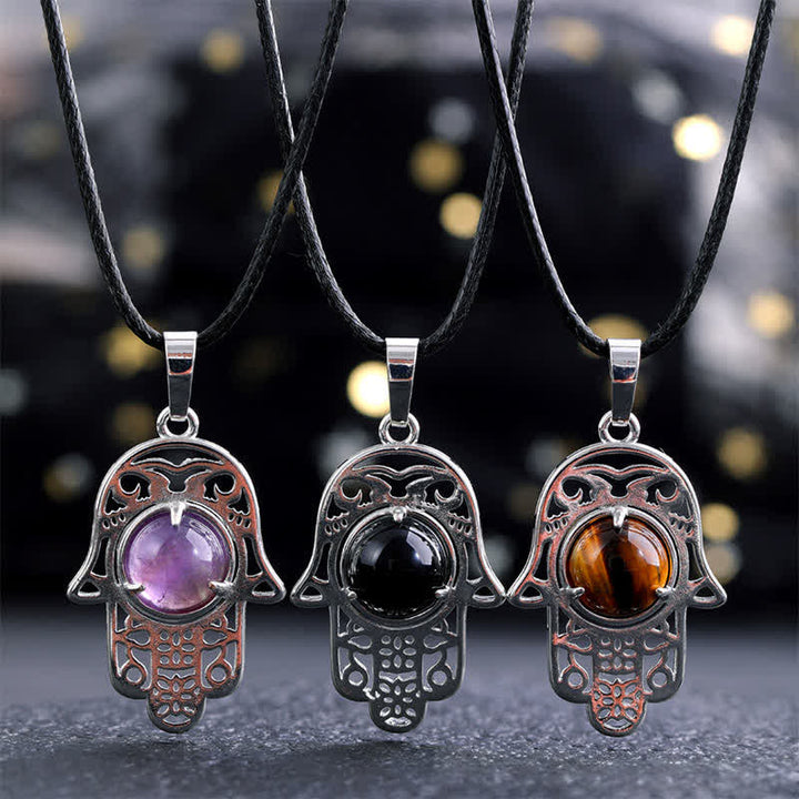 Buddha Stones Collier en obsidienne noire naturelle avec incrustation de palmier Hamsa et cristal de force - image 0