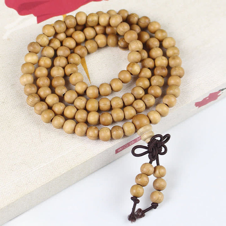 Buddha Stones Mala de 108 perles en bois de pêcher, poli à la main et noué, symbole de richesse - 6 mm - Normale - Bois de pêcher (Protection♥Purification) - image 0