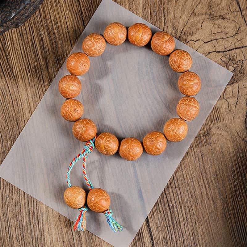 Buddha Stones Mala ethnique sculptée à la main représentant l'œil de phénix et la sagesse de Bodhi - Bracelet mala œil de phénix pour poignet - 15 mm - Œil de Phénix Bodhi (Protection ♥ Sagesse) - image 1