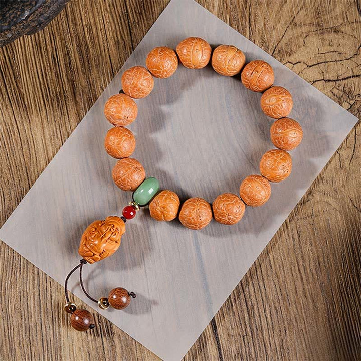 Buddha Stones Mala ethnique sculptée à la main représentant l'œil de phénix et la sagesse de Bodhi - Mala de poignet Œil de Phénix - 15 mm - Œil de Phénix Bodhi (Protection ♥ Sagesse) - image 0