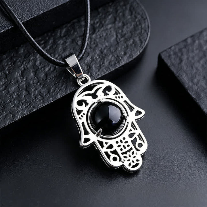 Buddha Stones Collier en obsidienne noire naturelle avec incrustation de palmier Hamsa et cristal de force - Obsidienne noire naturelle (la couleur peut varier) - image 1