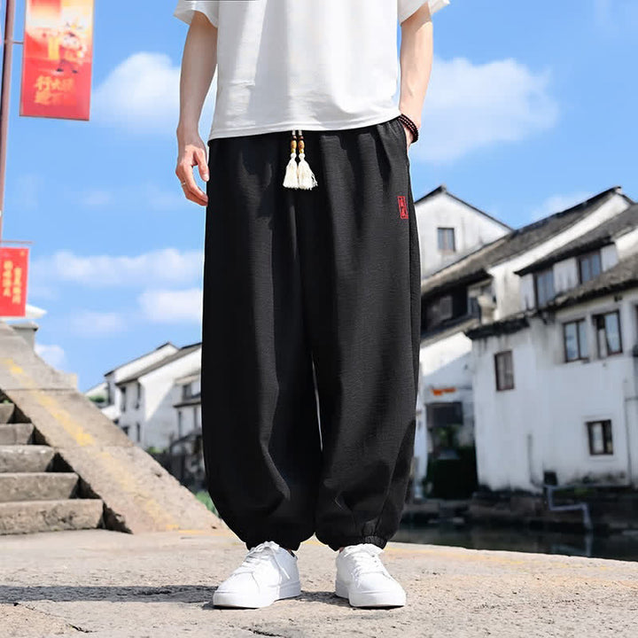 Buddha Stones Pantalon harem d'été pour homme, longueur cheville, à cordon de serrage, couleur unie, avec poches - Noir - US/UK/AU46，EU56 (5XL) - image 0