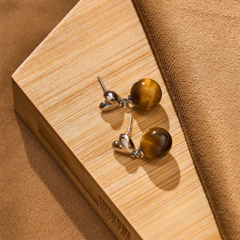 Buddha Stones Boucles d'oreilles en cuivre avec motif cœur œil de tigre et symbole du courage - image 3