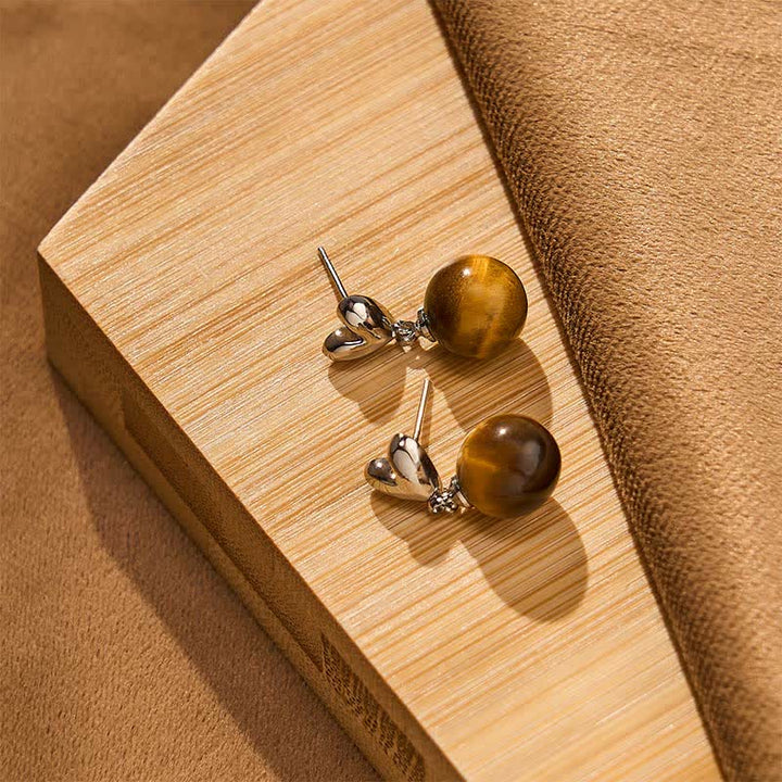 Buddha Stones Boucles d'oreilles en cuivre avec motif cœur œil de tigre et symbole du courage - image 3