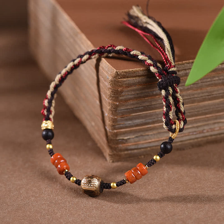Buddha Stones Bracelet à pompon tressé en bois de santal rouge tissé à la main - image 1