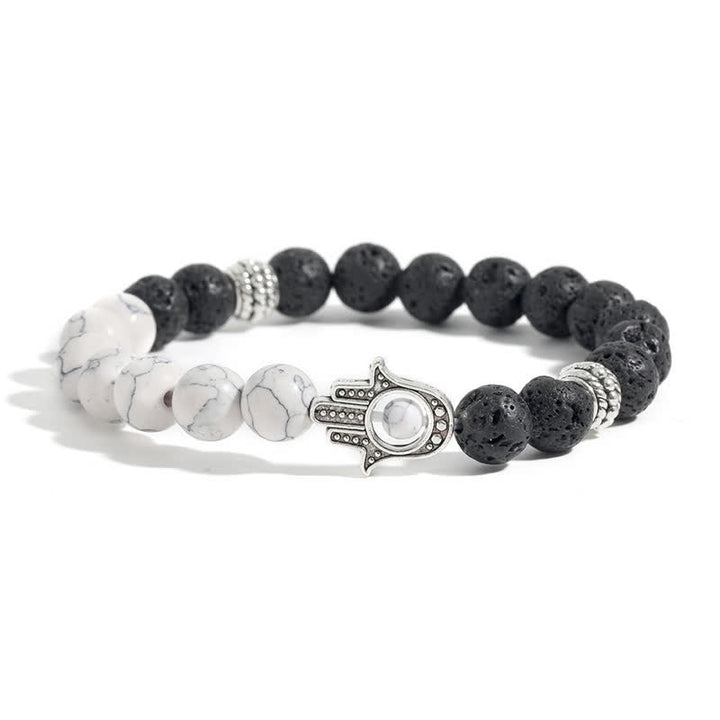 Buddha Stones Bracelet rond artisanal en pierre de lave et paume de Hamsa - Turquoise et roches de lave - image 1
