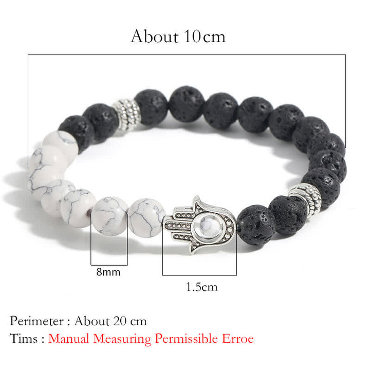 Buddha Stones Bracelet rond artisanal en pierre de lave et paume de Hamsa - image 15