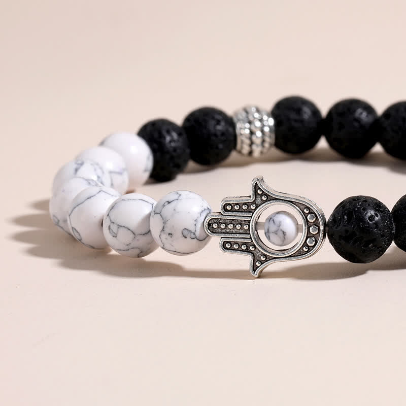 Buddha Stones Bracelet rond artisanal en pierre de lave et paume de Hamsa - image 16