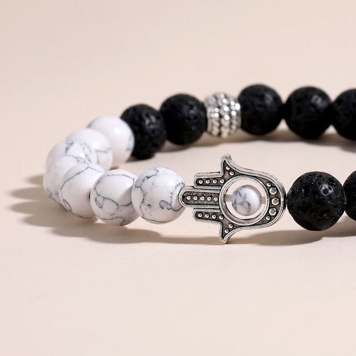 Buddha Stones Bracelet rond artisanal en pierre de lave et paume de Hamsa - image 16