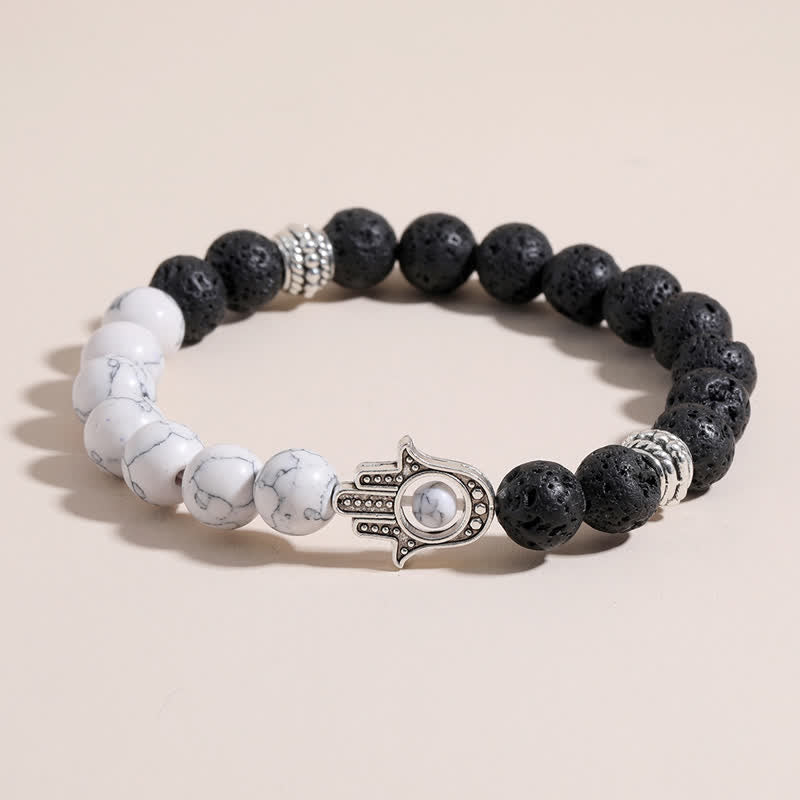 Buddha Stones Bracelet rond artisanal en pierre de lave et paume de Hamsa - image 0