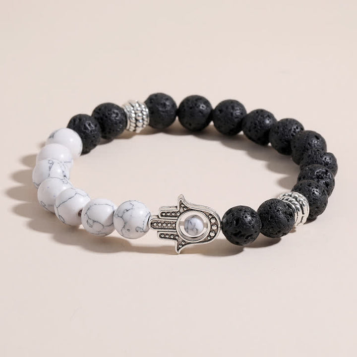 Buddha Stones Bracelet rond artisanal en pierre de lave et paume de Hamsa - image 0