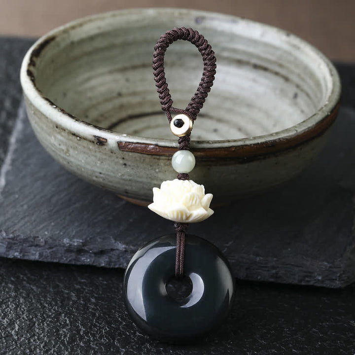 Buddha Stones Porte-clés de protection en obsidienne arc-en-ciel avec boucle de lotus et boucle de paix - Lotus - Porte-clés boucle de paix en obsidienne arc-en-ciel - Obsidienne arc-en-ciel (changements de couleur selon la lumière) - image 2