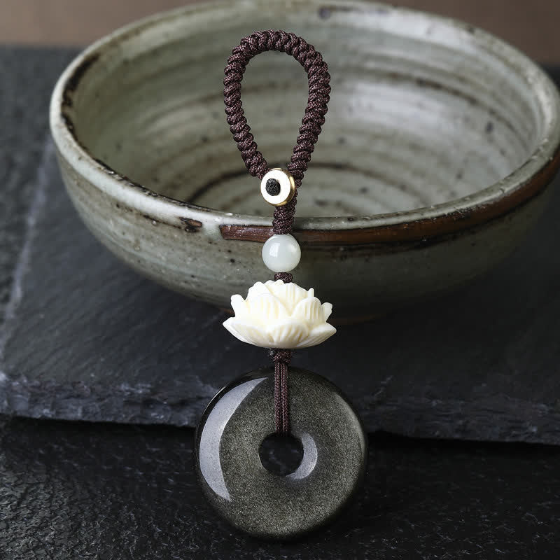 Buddha Stones Porte-clés de protection en obsidienne arc-en-ciel avec boucle de lotus et boucle de paix - Lotus - Porte-clés boucle de la paix en obsidienne dorée - Obsidienne arc-en-ciel (changements de couleur selon la lumière) - image 0