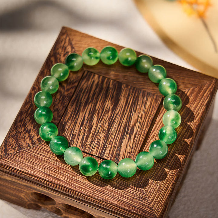 Buddha Stones Bracelet rond en calcédoine blanche, fleur verte flottante et perles de guérison - image 1