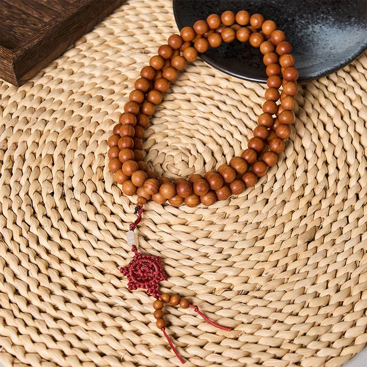 Buddha Stones Mala de perles rondes nouées, bénies par le bois de santal rouge, pour la méditation et la bénédiction. - 10 mm - Bois de santal rouge (Ancrage ♥ Méditation) - image 0