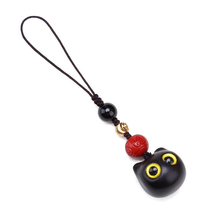 Buddha Stones Porte-clés en bois d'ébène sculptés à la main représentant un chat mignon symbolisant la paix et l'ancrage - image 16