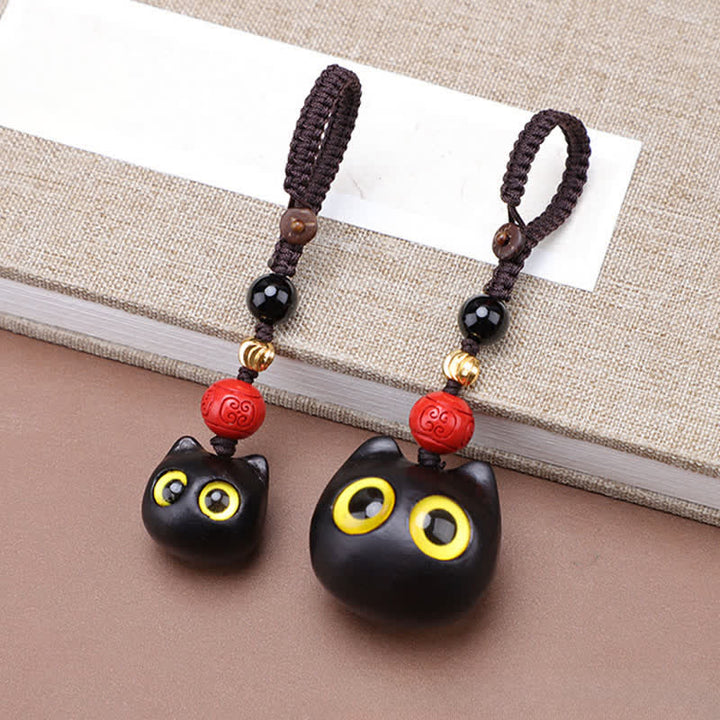 Buddha Stones Porte-clés en bois d'ébène sculptés à la main représentant un chat mignon symbolisant la paix et l'ancrage - image 8