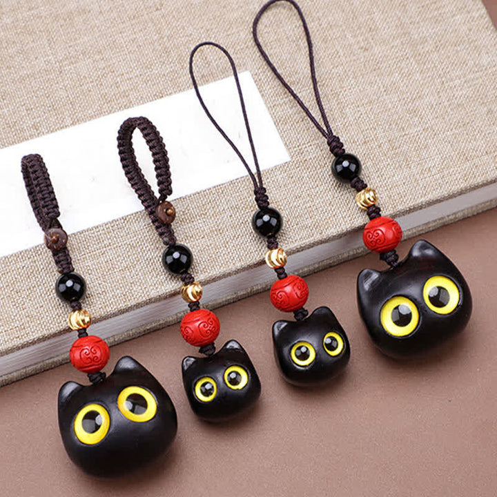 Buddha Stones Porte-clés en bois d'ébène sculptés à la main représentant un chat mignon symbolisant la paix et l'ancrage - image 20