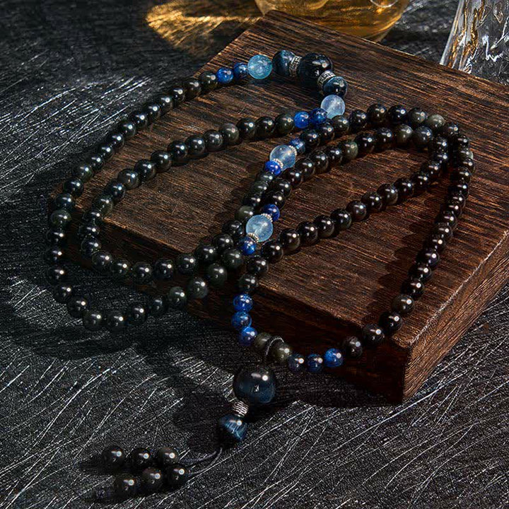 Mala de protection ronde en obsidienne noire de Buddha Stones, faite à la main, composée de 108 perles et ornée d'un pompon rond. - image 1