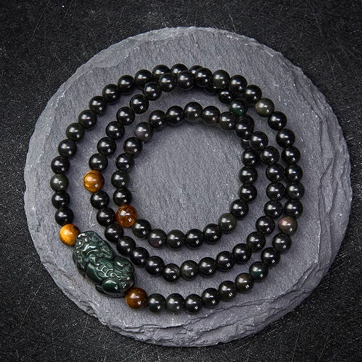 Buddha Stones Bracelet PiXiu en obsidienne arc-en-ciel et obsidienne noire, symbole de richesse, sculpté à la main. - Perle d'obsidienne arc-en-ciel (couleurs changeantes selon la lumière) - 6 mm - image 0