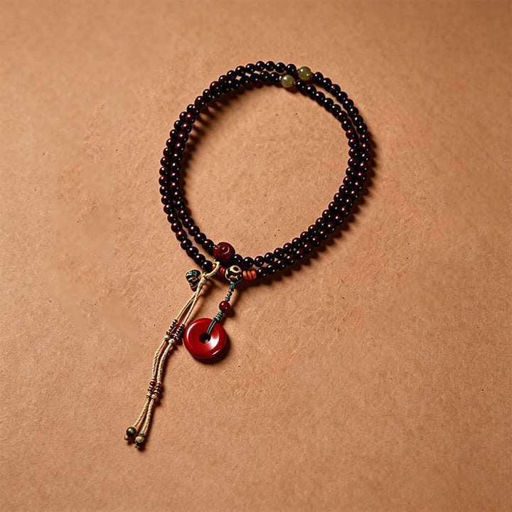Buddha Stones Mala de protection tissée à la main en bois de santal rouge, avec boucle de paix et 108 perles - image 2