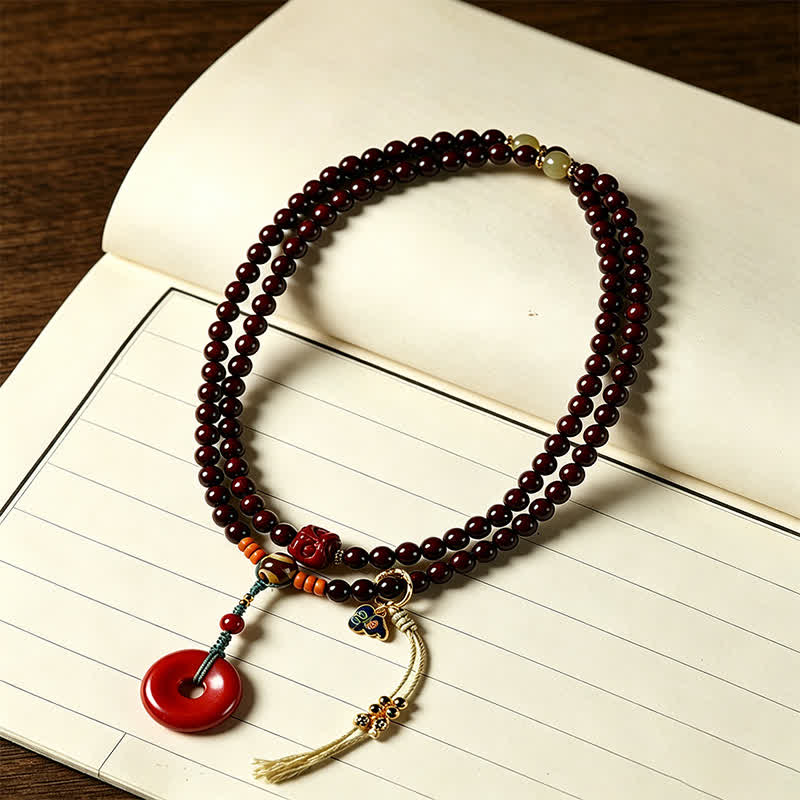 Buddha Stones Mala de protection tissée à la main en bois de santal rouge, avec boucle de paix et 108 perles - image 1