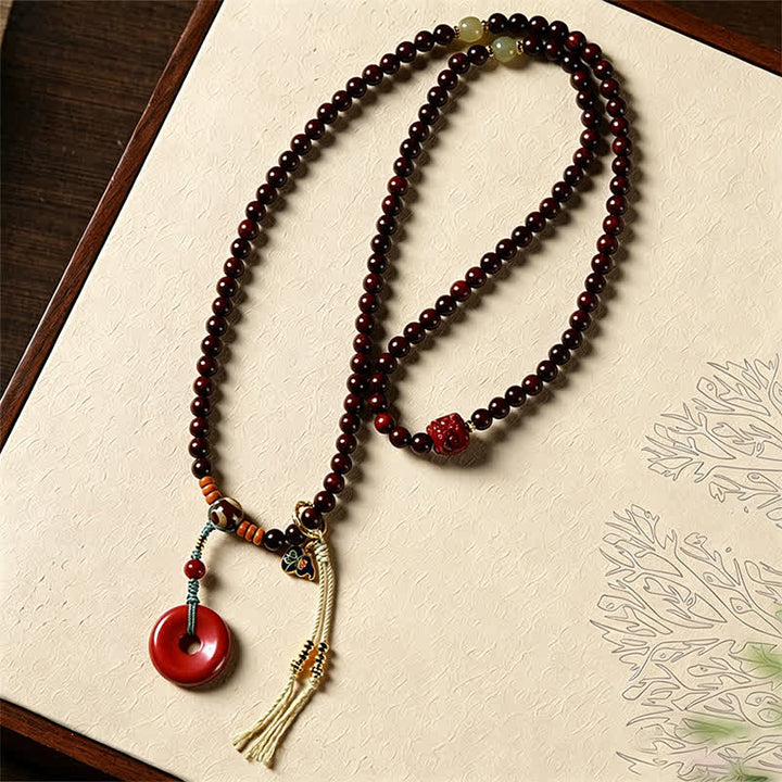 Buddha Stones Mala de protection tissée à la main en bois de santal rouge, avec boucle de paix et 108 perles - image 3
