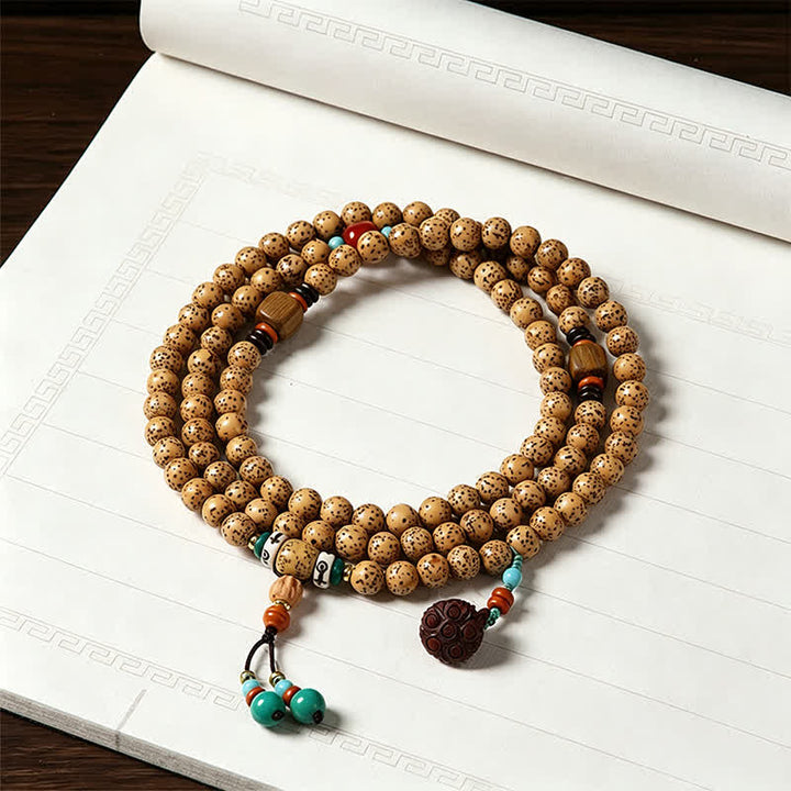 Buddha Stones Mala rond de 108 perles, orné de graines de lotus, de graines de Bodhi et d'étoiles, de lunes et de graines, fabriqué à la main. - Bouddha (Compassion ♥ Sérénité) - image 0
