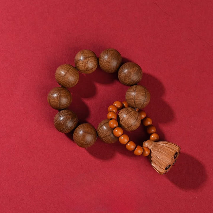 Buddha Stones Perles de méditation tactiles en bois de pêcher et gousse de lotus polies à la main, pour un ancrage optimal - Abelia Biflora (Protection ♥ Paix) - image 9