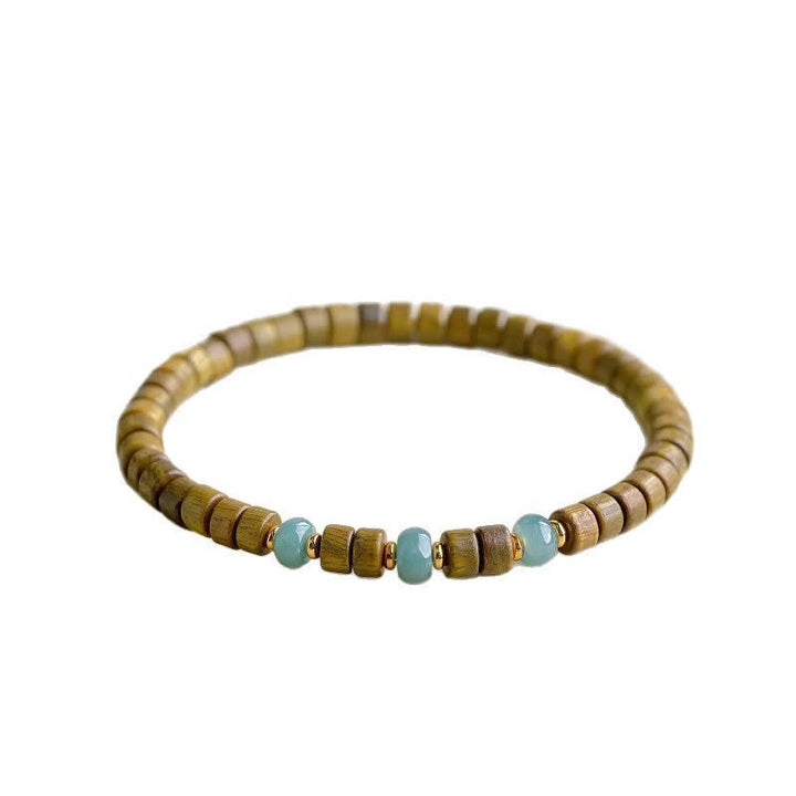 Buddha Stones Bracelet à perles cylindriques en bois de santal vert et jade, orné de santal et de pierres de sérénité - image 4
