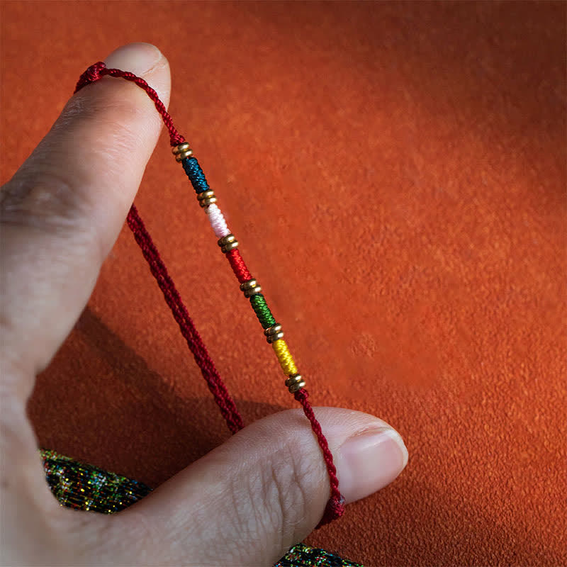 Buddha Stones Bracelet tibétain ajustable de protection tissé à la main avec un cordon rouge coloré - image 1