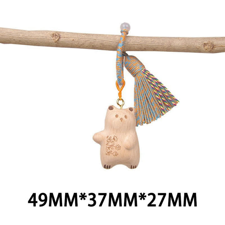 Buddha Stones Porte-clés porte-bonheur en bois clair sculpté à la main avec pompon chat, symbole d'ancrage - Ours en peluche bleu tourné vers la gauche - image 31