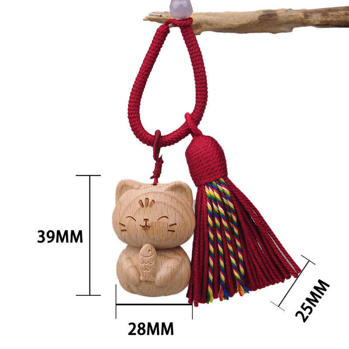 Buddha Stones Porte-clés porte-bonheur en bois clair sculpté à la main avec pompon chat, symbole d'ancrage - Chat bourguignon mangeant du poisson - image 15
